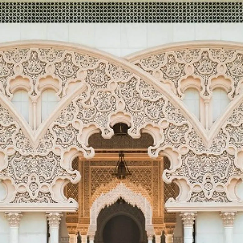 GRC arch with intricate carved pattern